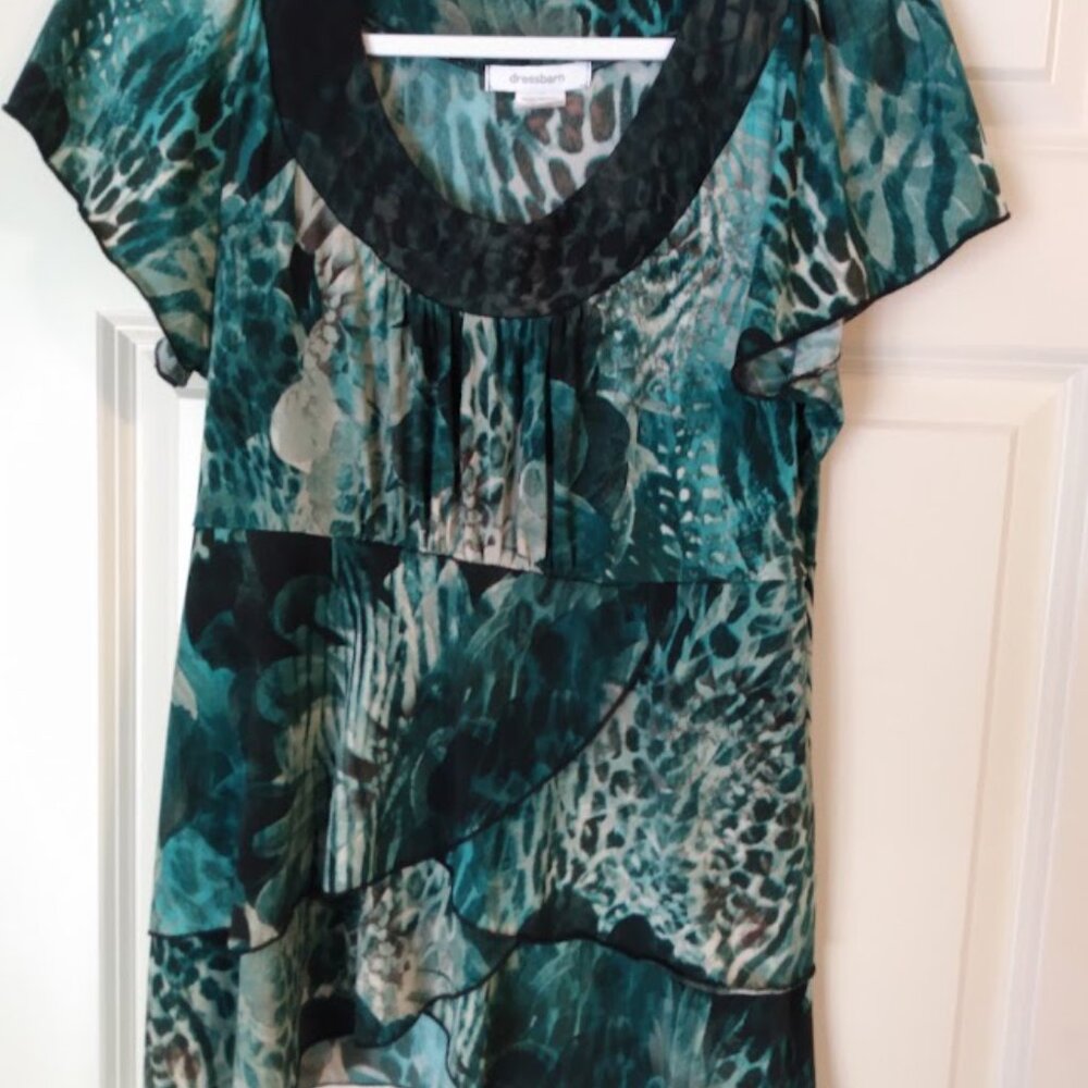 Dress Barn: Green /black cap sleeve blouse with ruffle bottom. Size medium.